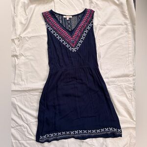 Size medium, Skies are Blue brand dress in navy blue with embroidered accents